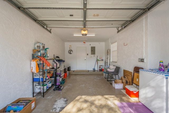 garage with fridge and electric panel