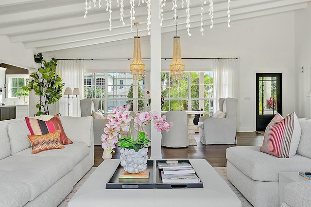 living room featuring vaulted ceiling with beams and wood finished floors