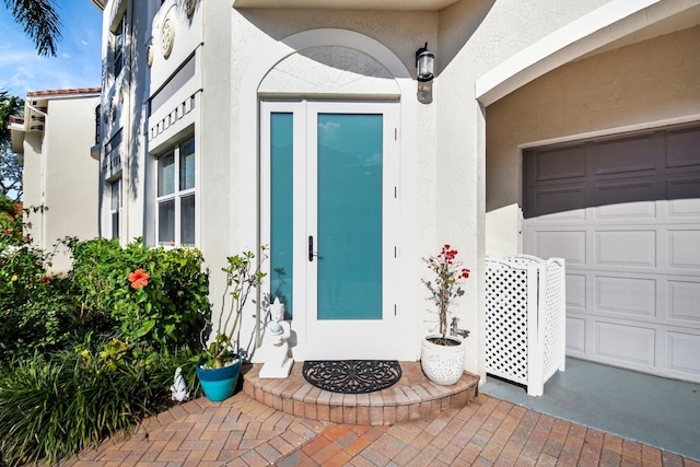 doorway to property featuring a garage