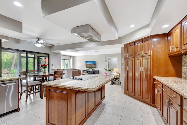 kitchen featuring black electric cooktop, a center island, dishwasher, and light tile patterned floors