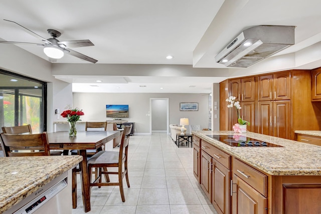 kitchen featuring light stone countertops, stainless steel dishwasher, black electric cooktop, and wall chimney exhaust hood