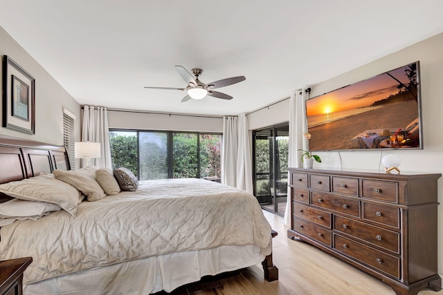 bedroom with access to exterior, light hardwood / wood-style floors, and ceiling fan