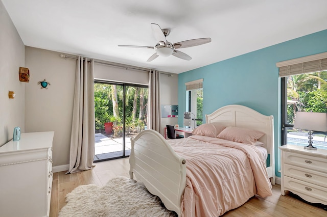 bedroom with multiple windows, access to outside, ceiling fan, and light hardwood / wood-style flooring