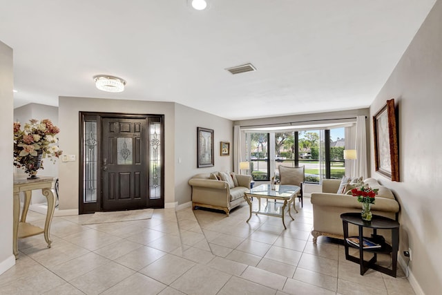 foyer entrance with light tile patterned flooring