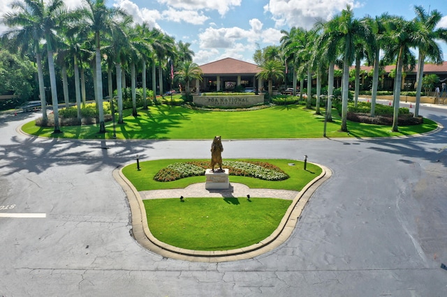 view of home's community featuring a lawn