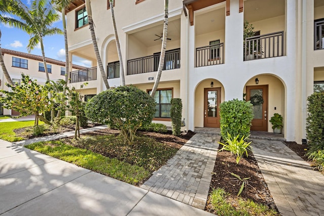 exterior space with ceiling fan