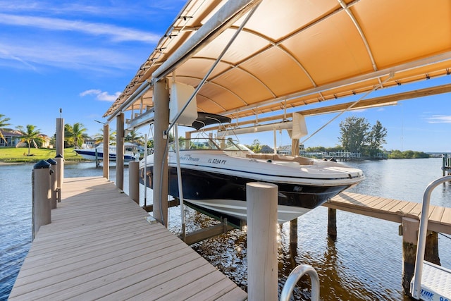 2666 SE Erickson Dr, Port Saint Lucie, FL 34984 - view of dock featuring a water view