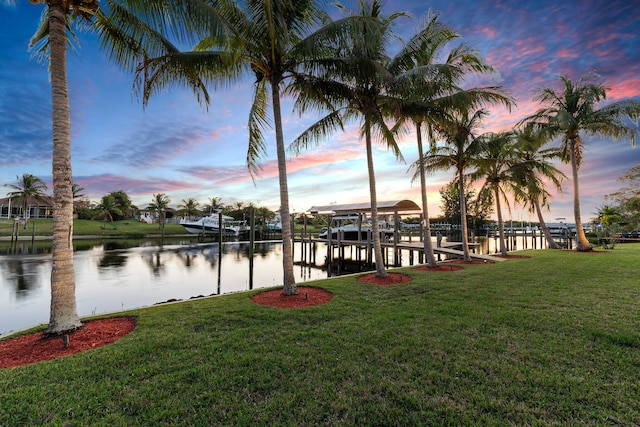 2666 SE Erickson Dr, Port Saint Lucie, FL 34984 - dock area featuring a water view and a yard