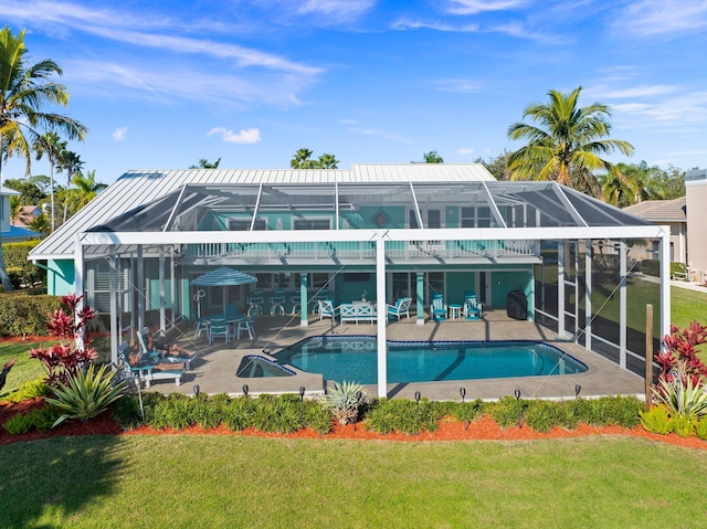 2666 SE Erickson Dr, Port Saint Lucie, FL 34984 - view of pool featuring a patio, a lanai, and a lawn