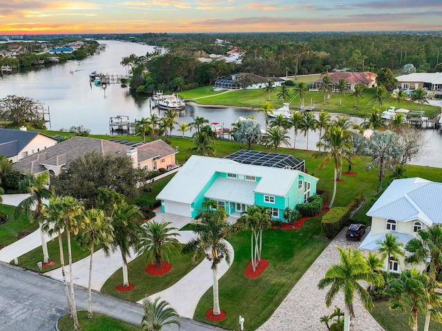 2666 SE Erickson Dr, Port Saint Lucie, FL 34984 - aerial view at dusk with a water view