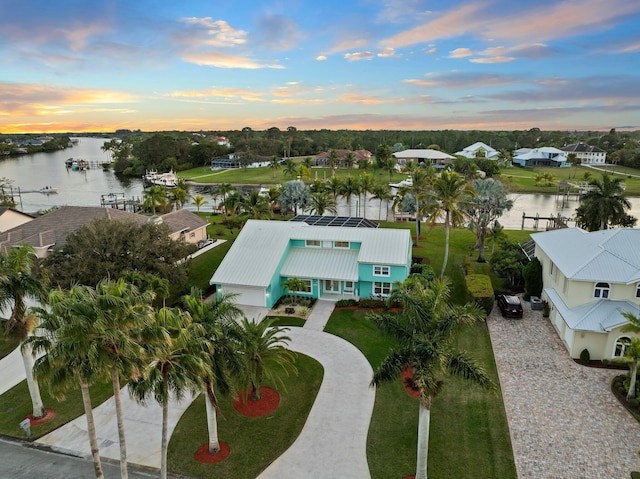 2666 SE Erickson Dr, Port Saint Lucie, FL 34984 - aerial view at dusk featuring a water view
