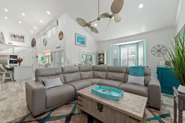 2666 SE Erickson Dr, Port Saint Lucie, FL 34984 - living room with ceiling fan, ornamental molding, and high vaulted ceiling