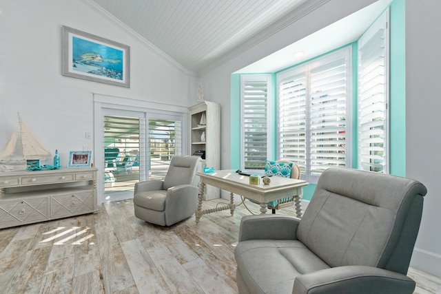 2666 SE Erickson Dr, Port Saint Lucie, FL 34984 - living area featuring ornamental molding, light hardwood / wood-style floors, and vaulted ceiling