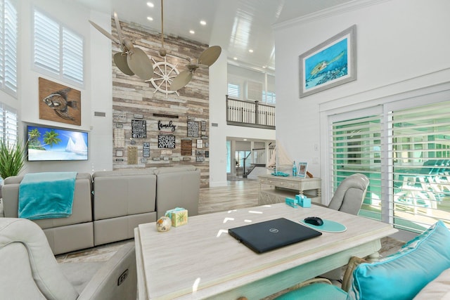 2666 SE Erickson Dr, Port Saint Lucie, FL 34984 - dining room with light hardwood / wood-style flooring, plenty of natural light, and a high ceiling