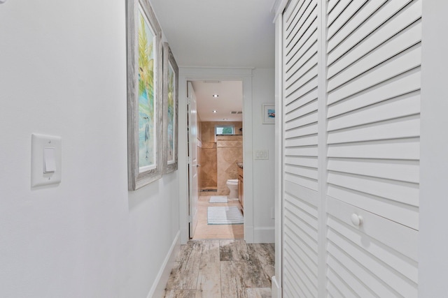 2666 SE Erickson Dr, Port Saint Lucie, FL 34984 - hallway featuring light hardwood / wood-style flooring