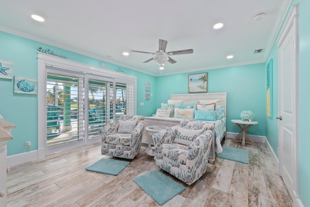 2666 SE Erickson Dr, Port Saint Lucie, FL 34984 - bedroom with access to exterior, ornamental molding, ceiling fan, and light wood-type flooring
