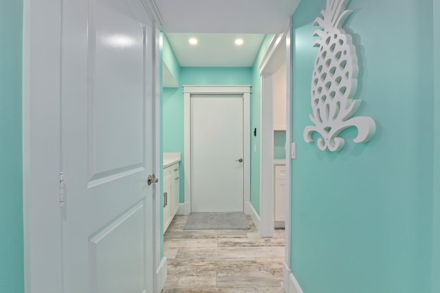 2666 SE Erickson Dr, Port Saint Lucie, FL 34984 - corridor featuring light hardwood / wood-style floors
