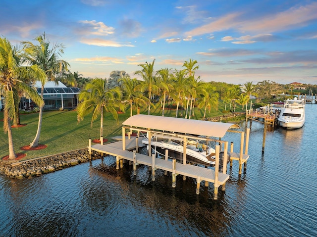 2666 SE Erickson Dr, Port Saint Lucie, FL 34984 - view of dock featuring a water view and a yard