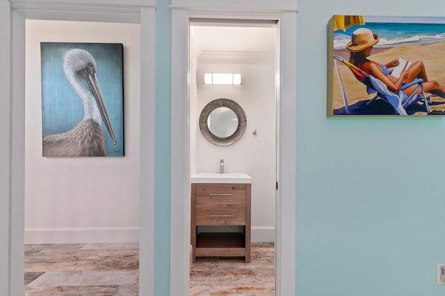 2666 SE Erickson Dr, Port Saint Lucie, FL 34984 - hall with sink and light hardwood / wood-style floors