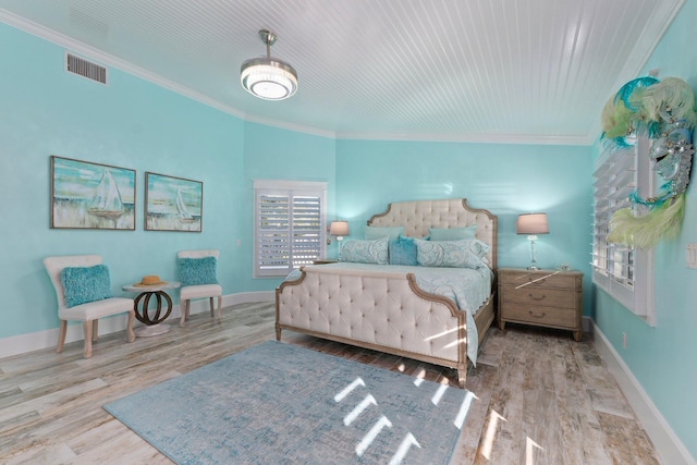 2666 SE Erickson Dr, Port Saint Lucie, FL 34984 - bedroom with ornamental molding and light hardwood / wood-style floors