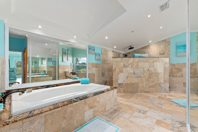 2666 SE Erickson Dr, Port Saint Lucie, FL 34984 - bathroom featuring lofted ceiling, crown molding, independent shower and bath, and tile walls