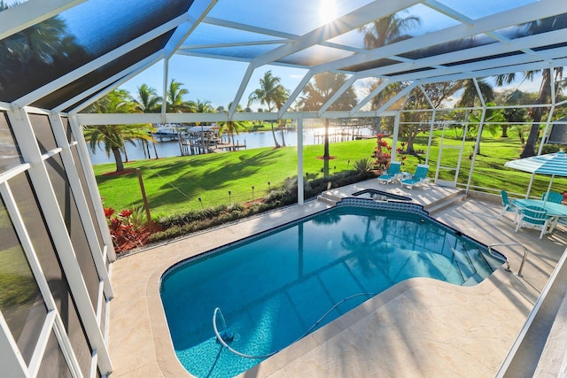 2666 SE Erickson Dr, Port Saint Lucie, FL 34984 - view of pool featuring a water view, a lanai, and a patio