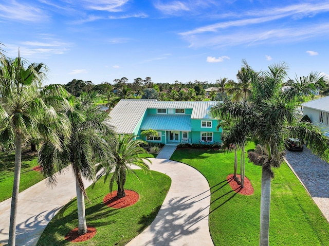 2666 SE Erickson Dr, Port Saint Lucie, FL 34984 - beach home featuring a front lawn