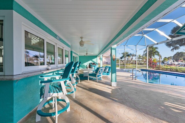 2666 SE Erickson Dr, Port Saint Lucie, FL 34984 - view of swimming pool featuring an outdoor hangout area, a patio, ceiling fan, and glass enclosure