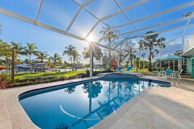 2666 SE Erickson Dr, Port Saint Lucie, FL 34984 - view of swimming pool with a patio, glass enclosure, and a water view