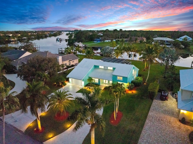 2666 SE Erickson Dr, Port Saint Lucie, FL 34984 - aerial view at dusk with a water view