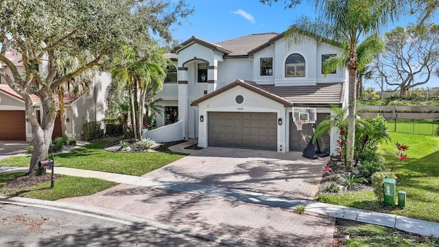 view of front of home with a garage and a front lawn