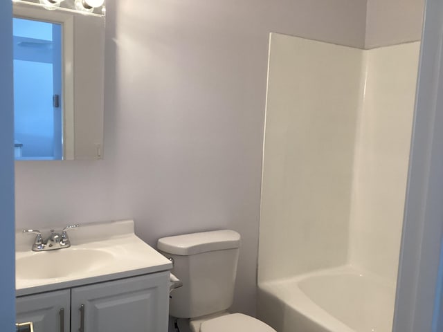 bathroom featuring shower / tub combination, vanity, and toilet