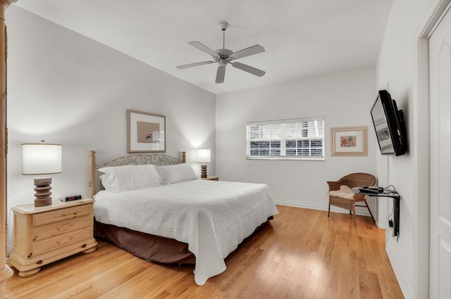 bedroom with ceiling fan and light hardwood / wood-style floors