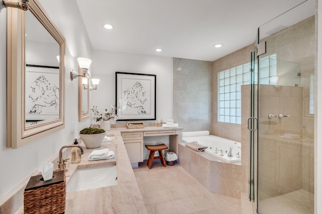 bathroom featuring plus walk in shower, vanity, and tile patterned floors