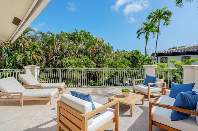 view of patio with a balcony and an outdoor hangout area