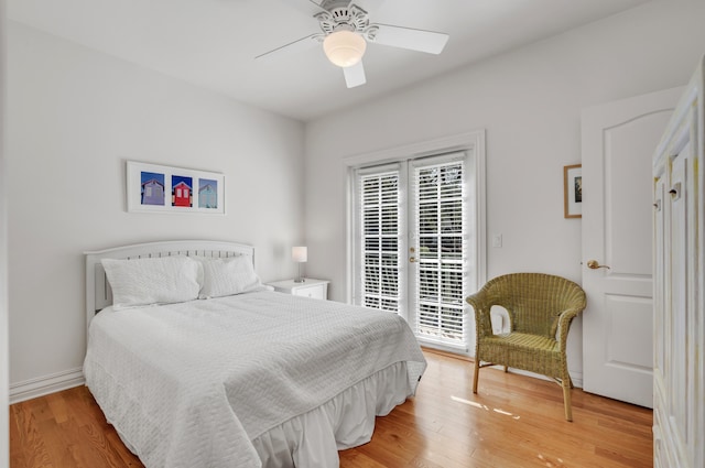 bedroom featuring ceiling fan, access to outside, and wood-type flooring