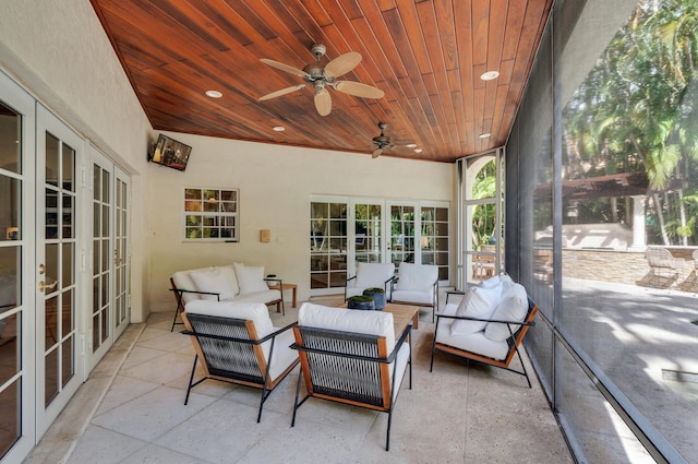 sunroom featuring wooden ceiling, french doors, and ceiling fan