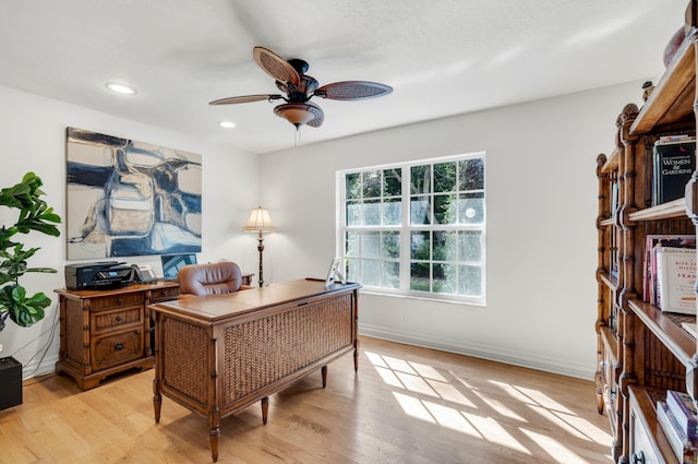 office with ceiling fan and light wood-type flooring