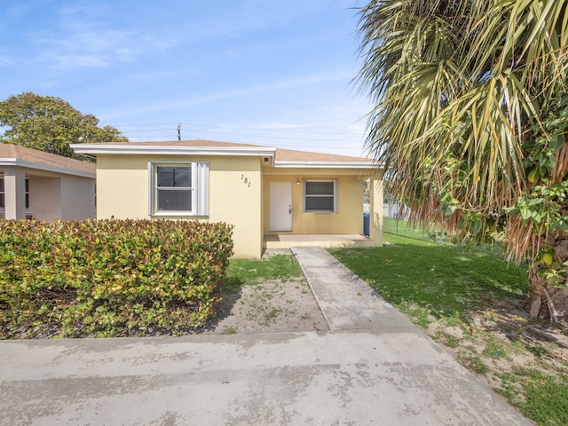 view of front of home with a front yard