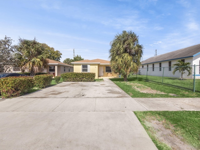 ranch-style house with a front yard