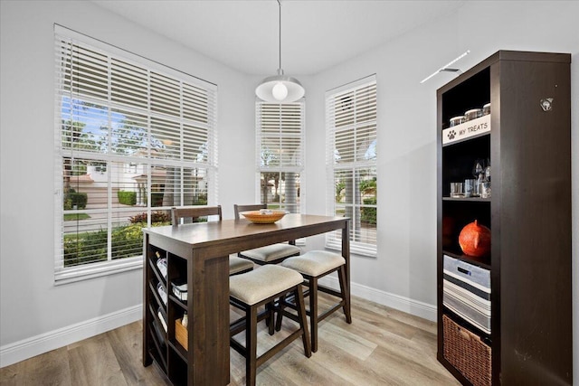 dining room with light wood-type flooring