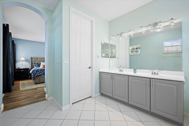 bathroom with tile patterned floors and vanity