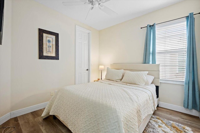 bedroom featuring ceiling fan and hardwood / wood-style floors