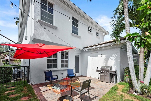 rear view of property with a patio area