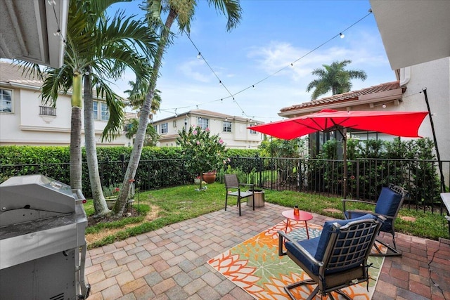 view of patio featuring a grill