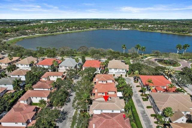 drone / aerial view with a water view