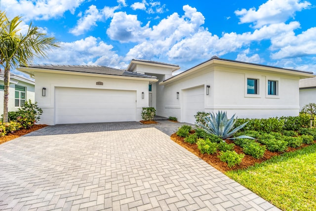 view of front of property featuring a garage