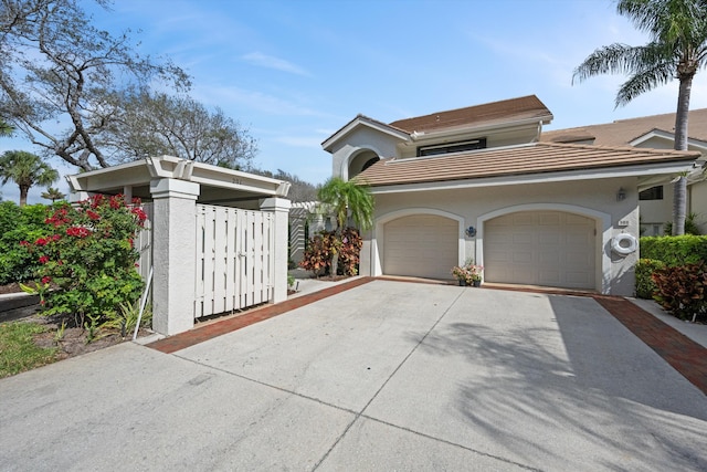 view of front facade featuring concrete driveway and stucco siding