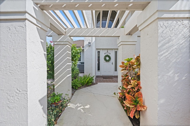 property entrance with stucco siding