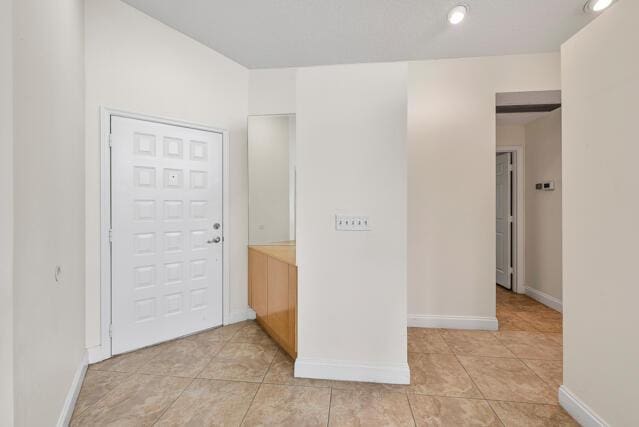 empty room with light tile patterned floors